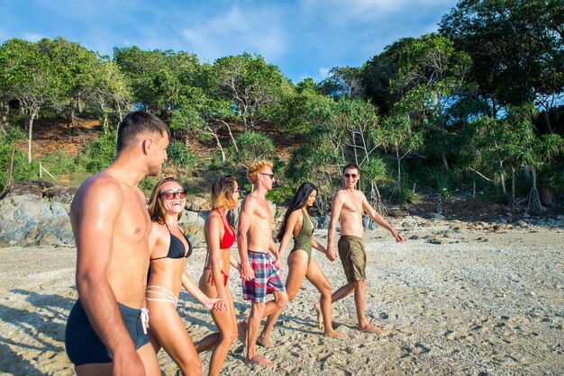 Group of happy friends on a tropical island