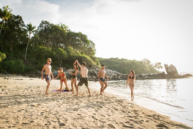 Group of happy friends on a tropical island