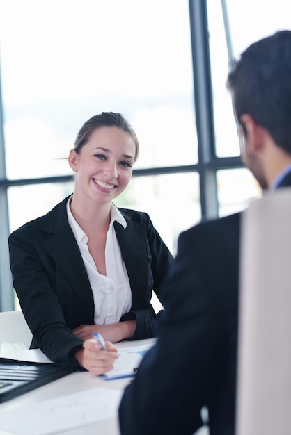 Group of happy young  business people in a meeting at office