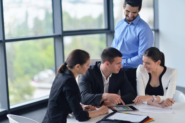 Group of happy young  business people in a meeting at office