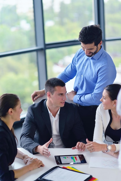 Group of happy young  business people in a meeting at office