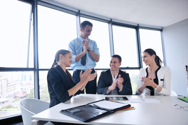 Group of happy young  business people in a meeting at office