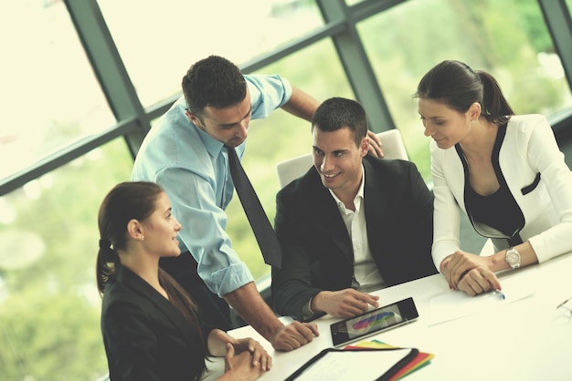 Group of happy young  business people in a meeting at office