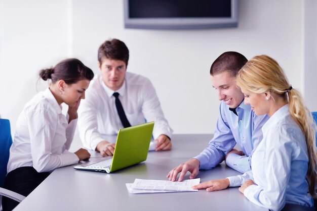 Group of happy young  business people in a meeting at office