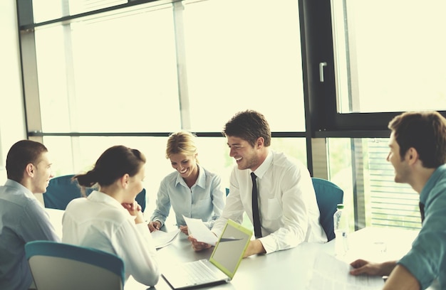 Group of happy young  business people in a meeting at office