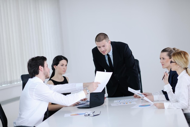 Group of happy young  business people in a meeting at office