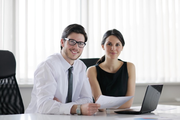 Group of happy young  business people in a meeting at office