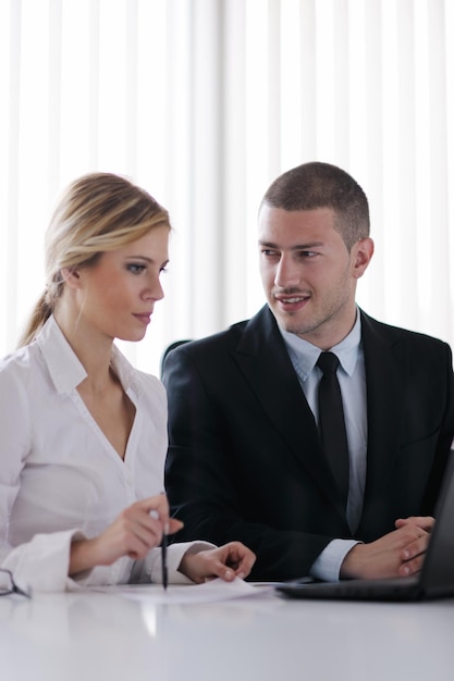 Group of happy young  business people in a meeting at office