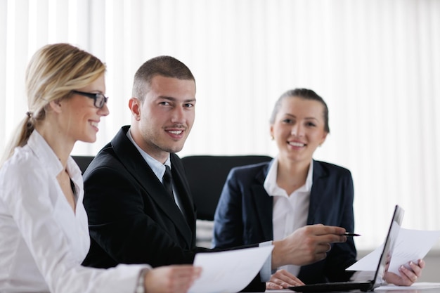 Group of happy young  business people in a meeting at office