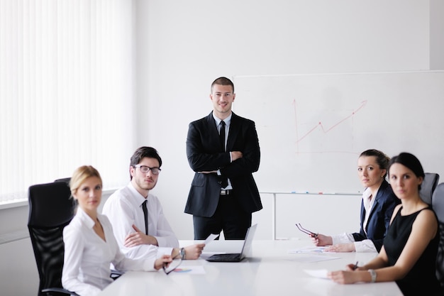 Group of happy young  business people in a meeting at office