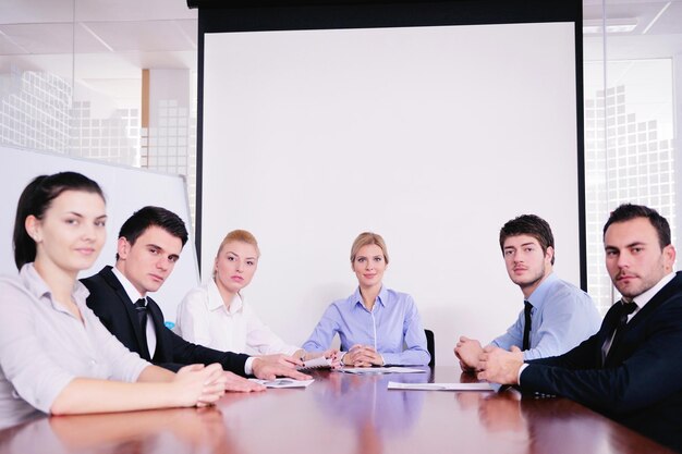 Group of happy young  business people in a meeting at office