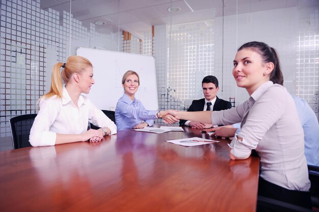 Group of happy young  business people in a meeting at office