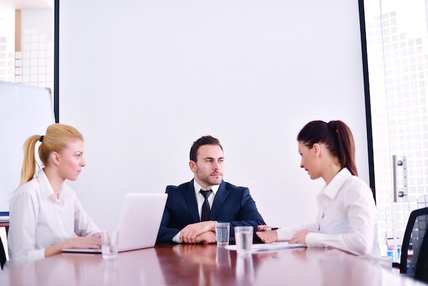 Group of happy young  business people in a meeting at office