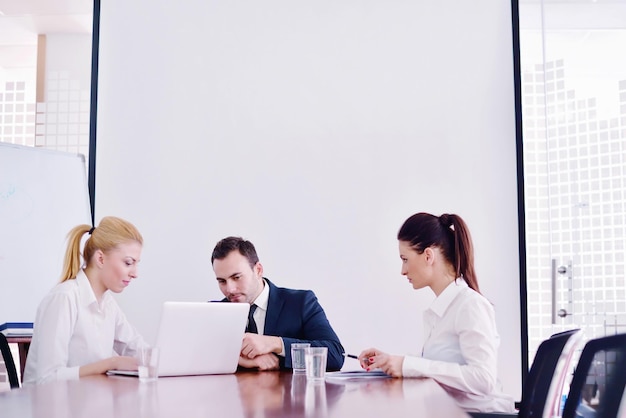 Group of happy young  business people in a meeting at office