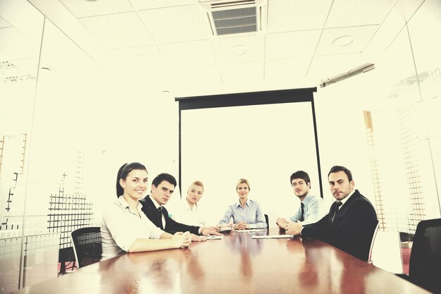 Group of happy young  business people in a meeting at office