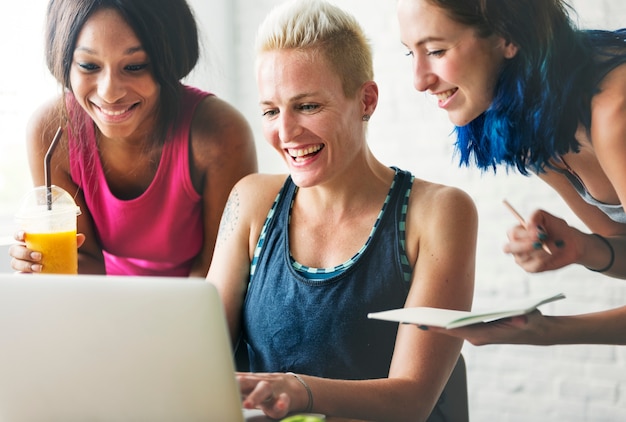 A group of healthy people is using laptop