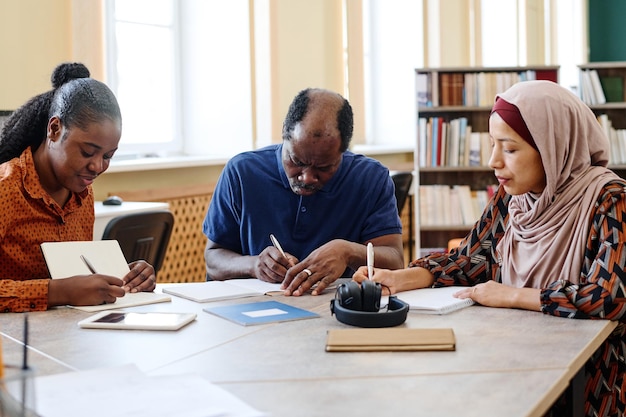 Group of Immigrants Making Notes