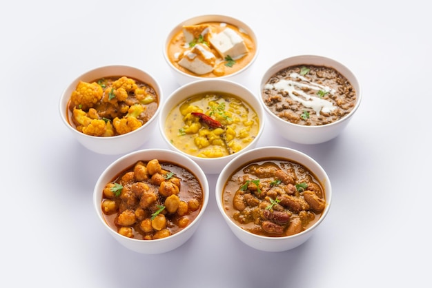 Group of Indian vegetarian dishes hot and spicy Punjabi cuisine meal assortment in bowls