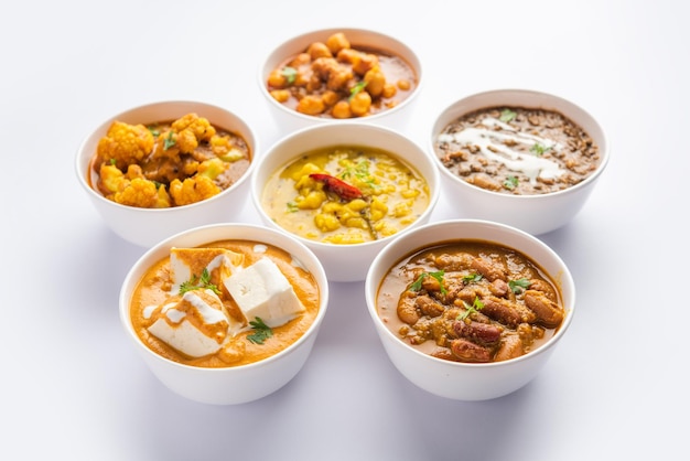 Group of Indian vegetarian dishes hot and spicy Punjabi cuisine meal assortment in bowls