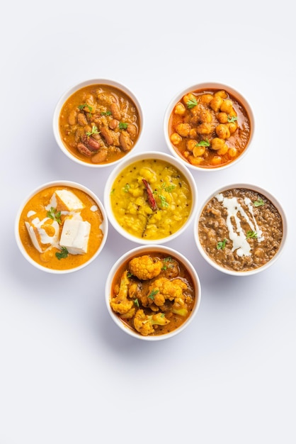 Group of Indian vegetarian dishes hot and spicy Punjabi cuisine meal assortment in bowls