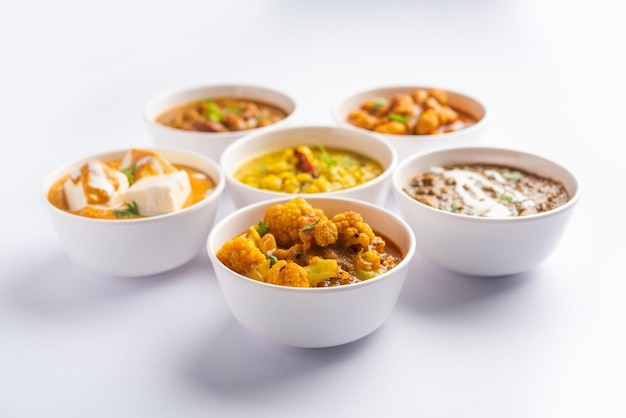 Group of Indian vegetarian dishes hot and spicy Punjabi cuisine meal assortment in bowls