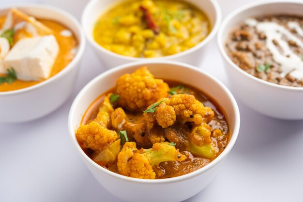 Group of Indian vegetarian dishes hot and spicy Punjabi cuisine meal assortment in bowls