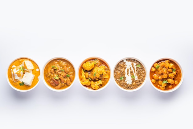 Group of Indian vegetarian dishes hot and spicy Punjabi cuisine meal assortment in bowls