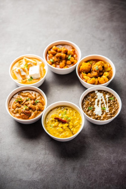 Group of Indian vegetarian dishes hot and spicy Punjabi cuisine meal assortment in bowls