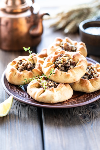 Group of individual pies with meat and potato. Tatar traditional pies.