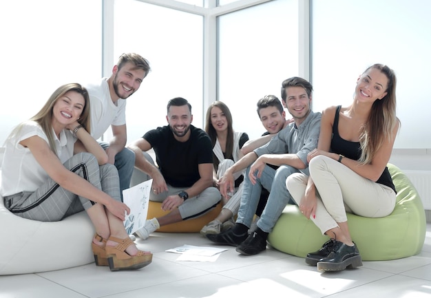 Group of initiative young people sitting in the new office the concept of a startup