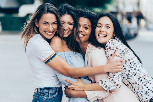 Group of international young adult women in city