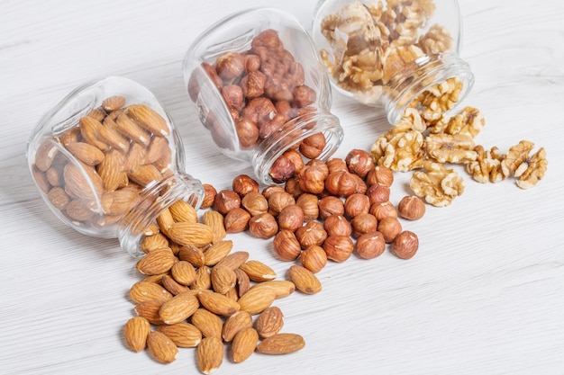 Group of jar with hazelnut,nut,and almonds