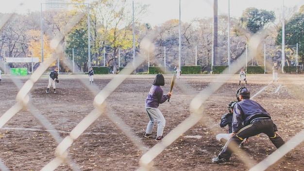 Photo group of kids practicing baseball