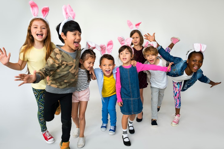 Photo group of kids wearing bunny ears for easter happiness smiling on white blackground