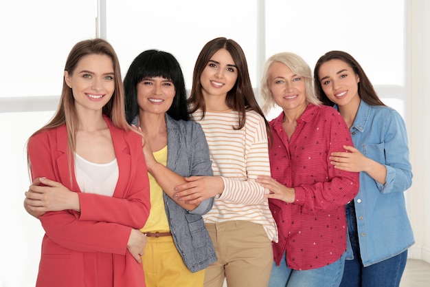 Group of ladies near window indoors Women power concept