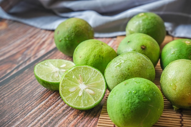 Group of lime with wooden texture background