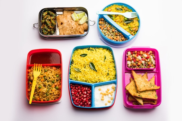 Group of Lunch Box or Tiffin for Indian kids, showing variety or multiple option or combination of healthy food for your school going children