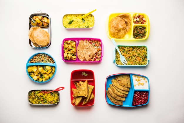 Group of Lunch Box or Tiffin for Indian kids, showing variety or multiple option or combination of healthy food for your school going children