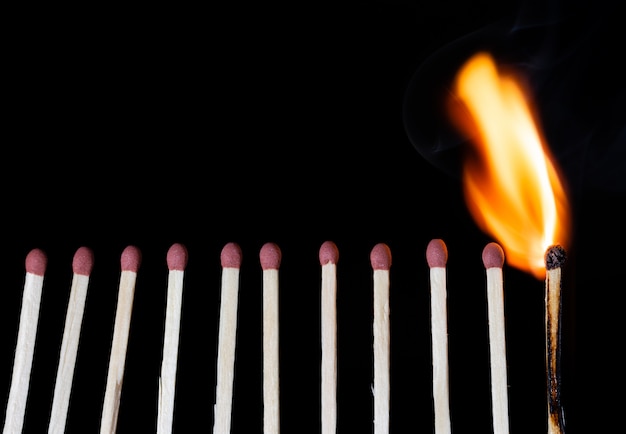 Group Of Matches Lit In Row Burning