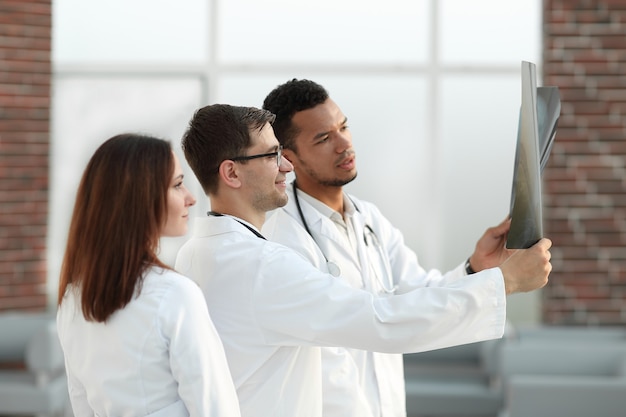 Group of medical doctors discussing the patient's x-ray. the concept of health