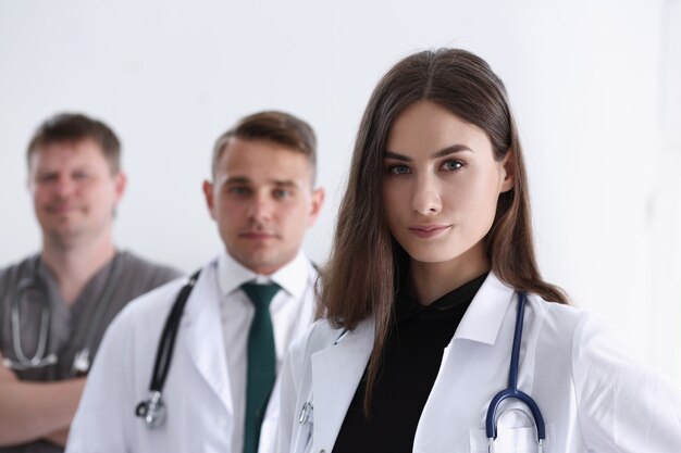 Group of medics proudly posing in row and