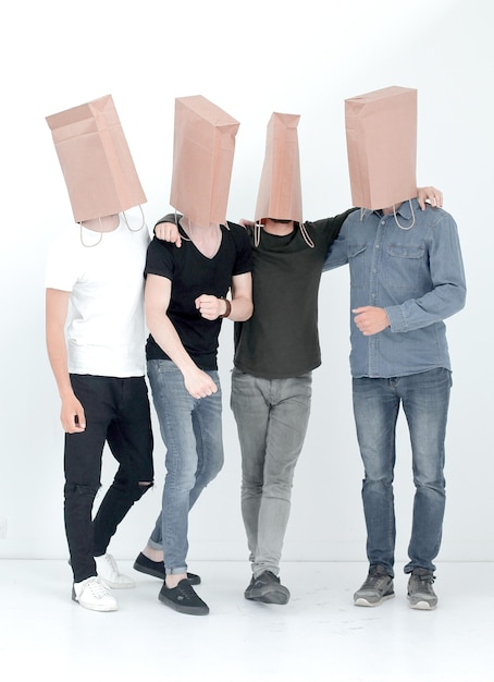 Group of men with paper bags on their heads