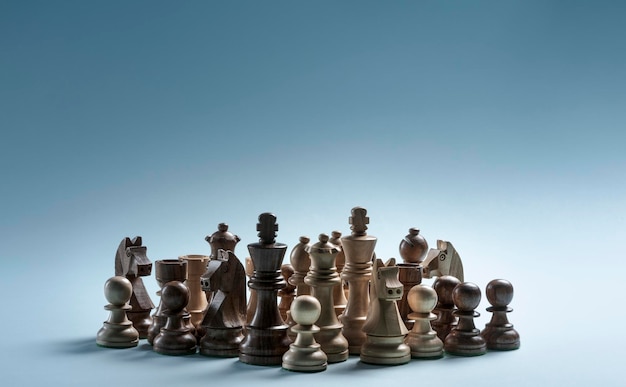 Group of mixed wooden chess pieces standing together togetherness and diversity concept
