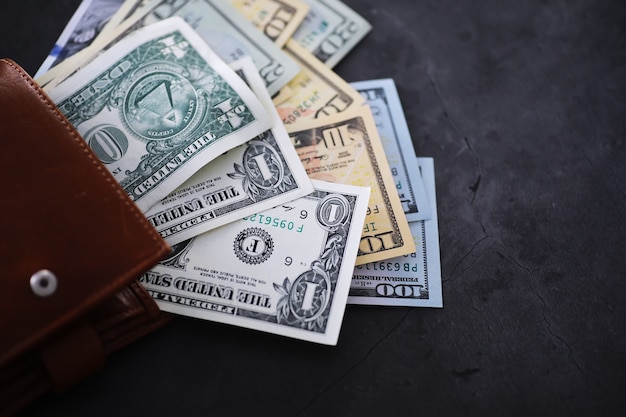 Group of money stack of 100 US dollars banknotes a lot of the background texture. Cash money in a large pile as a finance background.