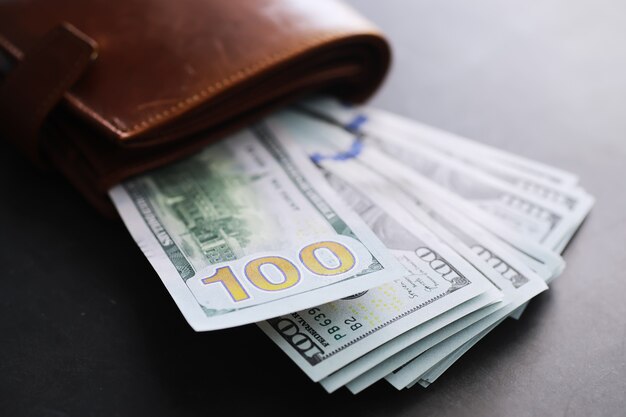 Group of money stack of 100 US dollars banknotes a lot of the background texture. Cash money in a large pile as a finance background.