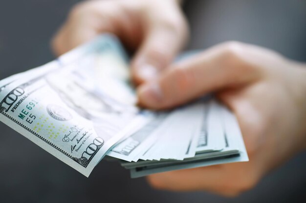 Group of money stack of 100 US dollars banknotes a lot of the background texture. Cash money in a large pile as a finance background.