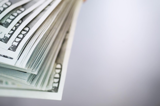 Group of money stack of 100 US dollars banknotes a lot of the background texture. Cash money in a large pile as a finance background.