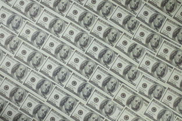 Photo group of money stack of 100 us dollars banknotes a lot of is arranged in a beautiful