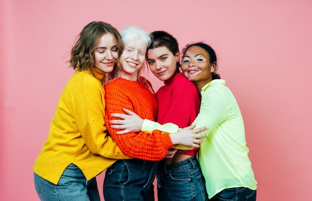 group of multiethnic women with different kind of skin posing together in studio