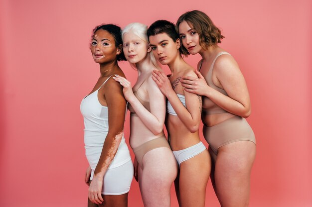 Premium Photo  Diversity women body shape and portrait of group together  for inclusion natural beauty and power underwear model friends happy on  beige background with cellulite pride and self love motivation